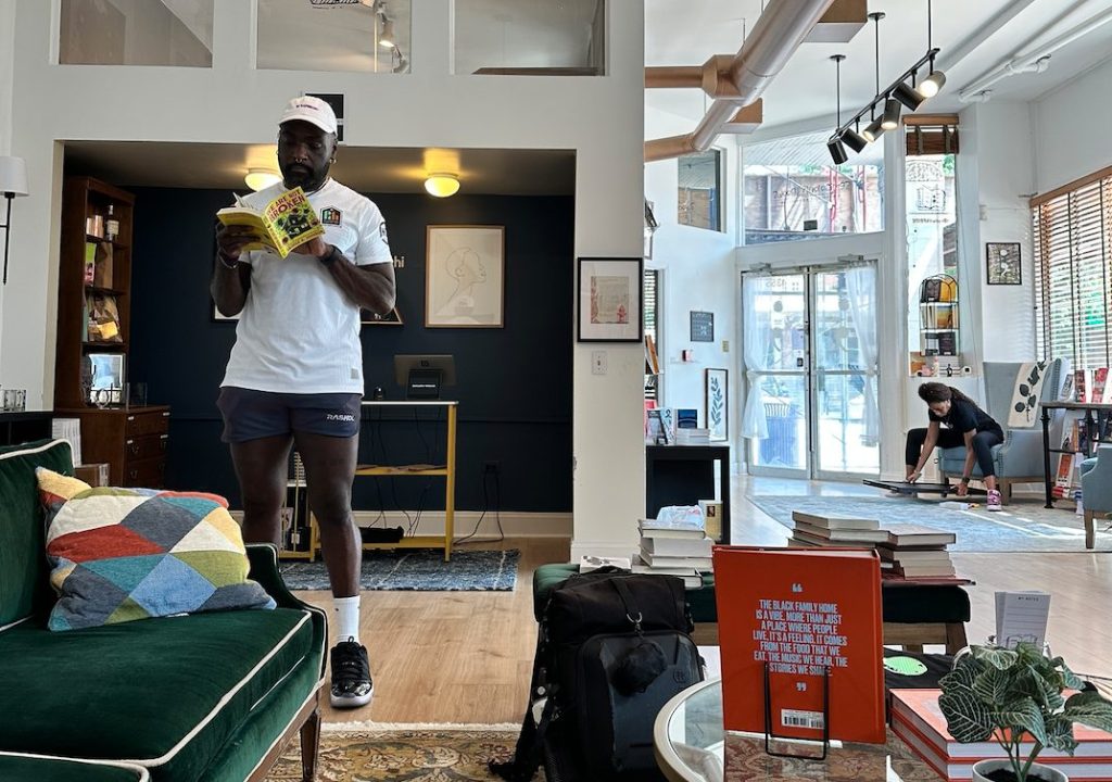 roy kinsey peruses books at semicolon bookstore